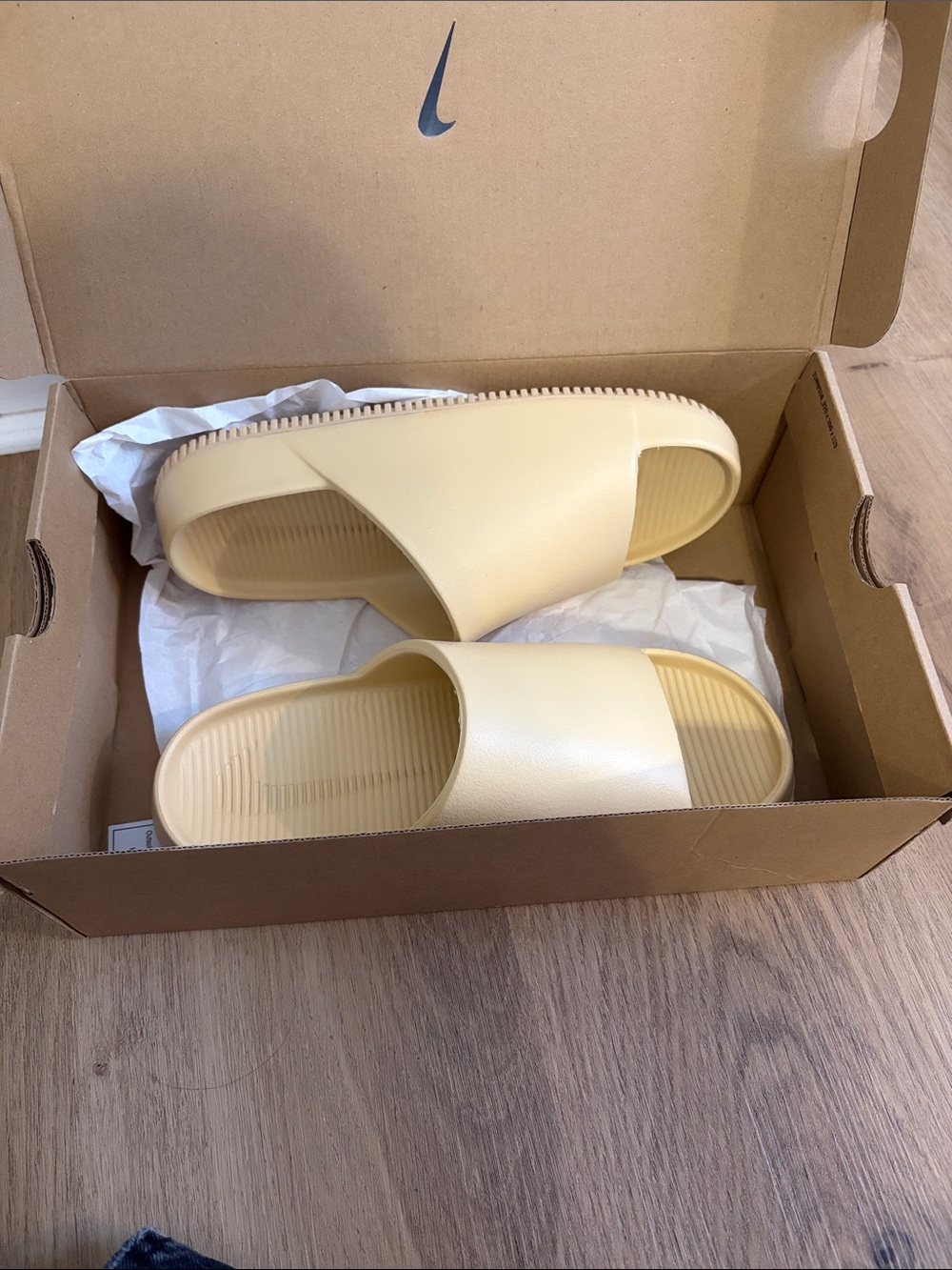 Nike Women's Slide Sandals in Pale Yellow